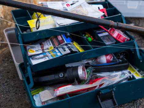A fully stocked fishermans tackle box fully stocked with lures and
